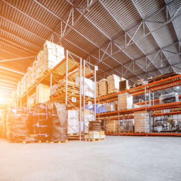 istockphoto-672320826-612×612 Large hangar warehouse industrial and logistics companies. Warehousing on the floor and called the high shelves. Toning the image.